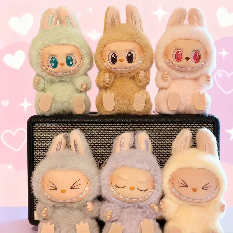 Set of plush toys in bunny costumes on a pink background with hearts and stars.
