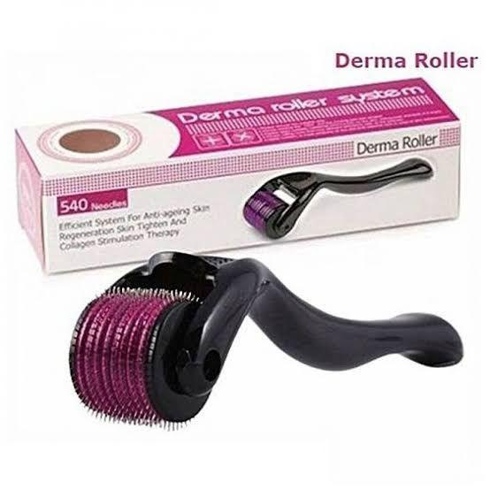 Derma roller with 540 needles for anti-aging skin and collagen stimulation, shown with pink and black packaging