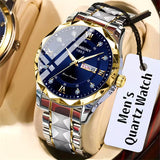 Gold and silver watch with blue face on a beige surface, featuring a 'Men's Quartz Watch' tag.