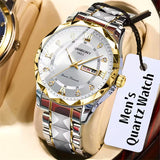 Gold and silver watch with a visible brand name on a beige background