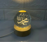 Illuminated Islamic calligraphy of Prophet Muhammad on glass globe lamp with wooden base