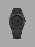 Matte black wristwatch with minimalist dial and Arabic numerals on a gray background