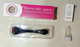Derma roller system kit with black derma roller, pink and white box, and small plastic container on beige surface
