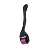 black microneedle derma roller with purple needles on a white background